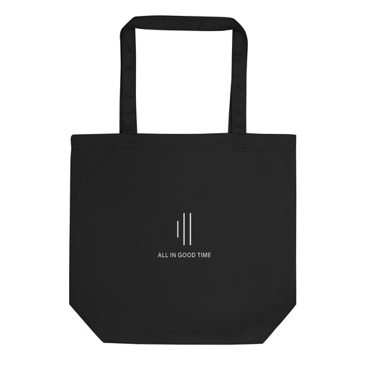 Black tote bag for drummers by Cowbell & Groove, featuring minimalist groove bar design and 'All in Good Time' slogan — perfect drummer gift idea