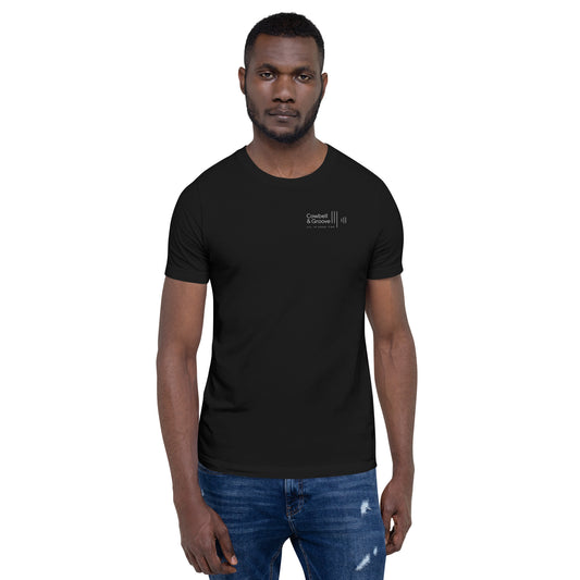 Man wearing black drummer tee by Cowbell & Groove, minimalist groove logo on front, front-facing view