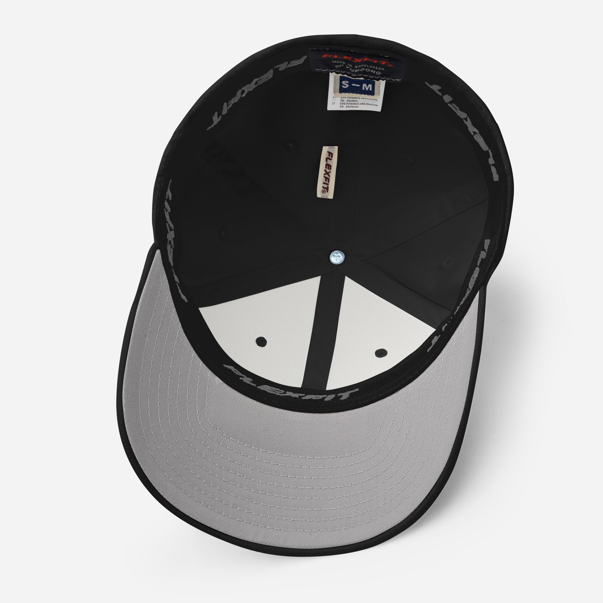 Underside view of structured twill drummer cap by Cowbell & Groove, showing gray visor and Flexfit interior band — fitted musician hat detail